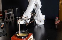 A robot built by the start-up Workshop 4.0 is designed to make Swiss fondue