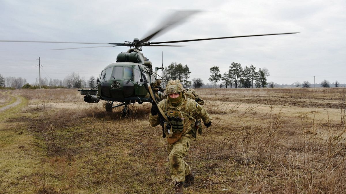 Service members of the Ukrainian Air Assault Forces take part in tactical drills at a training ground in an unknown location in Ukraine in February 2022.