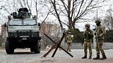 Ukrainian Military Forces servicemen block a road in the so-called government quarter in Kyiv on February 24, 2022.