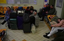 People from Ukraine, rest at a train station that was turned into an accommodation center in Przemysl, Poland