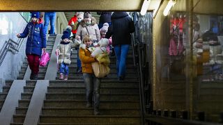 eople fleeing the conflict from neighboring Ukraine arrive to Przemysl train station in Przemysl, Poland, on Friday, Feb. 25, 2022.