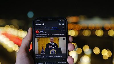 The app of Facebook showing U.S. President Joe Biden speaking, is viewed on an smartphone in Moscow, Russia, Friday, February 25, 2022.