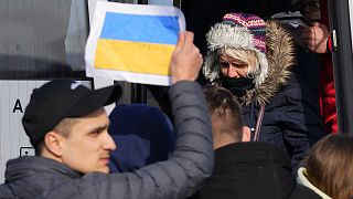 Refugees fleeing the conflict from neighboring Ukraine are transported by bus in the border town of Przemysl, Poland,