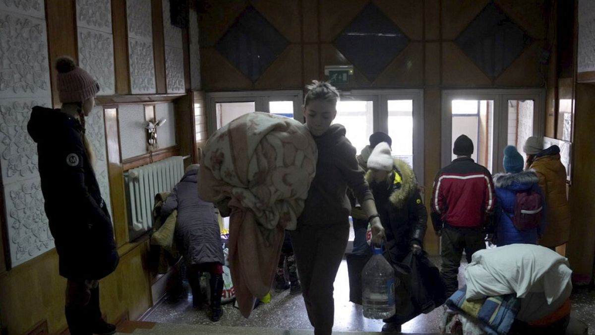 People take shelter inside a building in Mariupol, Ukraine
