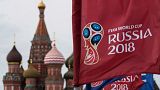 A flag with the logo of the World Cup 2018 on display with the St. Basil's Cathedral in Moscow