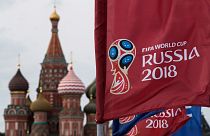 A flag with the logo of the World Cup 2018 on display with the St. Basil's Cathedral in Moscow