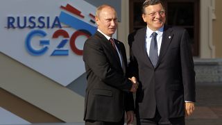 Vladimir Putin shakes hands with European Commission President Jose Manuel Barroso at a G-20 summit in St. Petersburg in 2013.