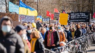 Protestors take part in a demonstration against Russia's military intervention in Ukraine in Bern, Switzerland, Saturday, February 26, 2022.
