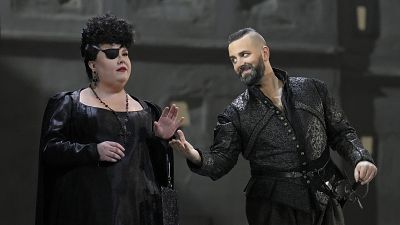 Jamie Barton as Princess Eboli, left, and Etienne Dupuis as Rodrigue in Verdi's "Don Carlos." The Metropolitan Opera is presenting the original French version