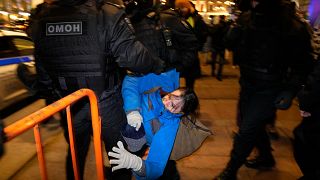 Police detain a demonstrator during an action against Russia's attack on Ukraine in St. Petersburg, Russia, Saturday, Feb. 26, 2022