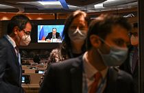 Ambassadors and diplomats leave the room while Russia's foreign minister Sergei Lavrov addresses with a pre-recorded video message the Conference on Disarmament
