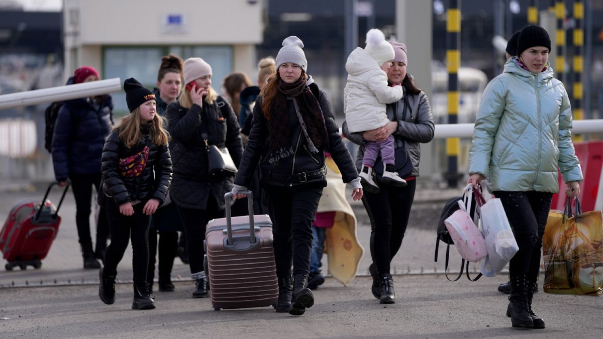 Refugees from Ukraine cross into Poland at the Medyka crossing, Tuesday, March 1, 2022