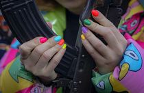 A young woman handles a weapon during a basic combat training for civilians, organized by the Special Forces Unit Azov, of Ukraine's National Guard, in Mariupol