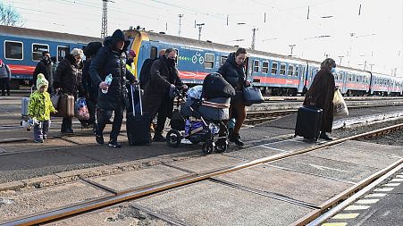 Refugees arrive from Ukraine at the railway station in the Hungarian-Ukrainian border town of Zahony