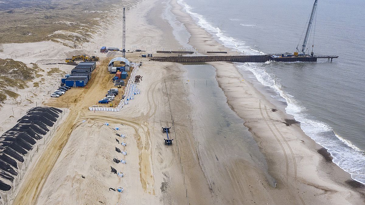 Construction work being carried out on a 200 meter long pier being built where the gas pipeline is due to come ashore at Houstrup Strand, in West Jutland, Denmark