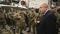 British Prime Minister Boris Johnson meets NATO troops after a joint press conference at an airbase in Tallinn, Tuesday, March 1, 2022. 