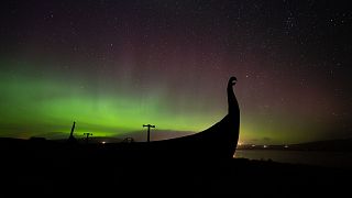 The 'Mirrie Dancers' behind a Viking longship on the UK's most northerly isle of Unst, Shetland.