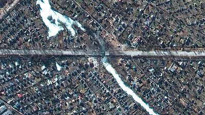 This satellite image provided by Maxar Technologies shows destroyed bridge and homes in Chernihiv, Ukraine on Feb. 28, 2022. 