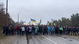 Video footage shared by Enerhodar's City Council showed people en masse standing on the street and blocking the entrance to the city in Enerhodar, Ukraine, on March, 3, 2022.