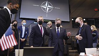 U.S. Secretary of State Antony Blinken speaks with NATO Secretary General Jens Stoltenberg during an extraordinary NATO foreign ministers meeting
