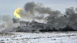 The Russian army's self-propelled howitzers fire during military drills near Orenburg in the Urals, Russia, Dec. 16, 2021.