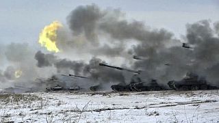 The Russian army's self-propelled howitzers fire during military drills near Orenburg in the Urals, Russia, Dec. 16, 2021.