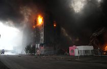 A building burns after shelling in Kyiv, Ukraine, Thursday, March 3, 2022