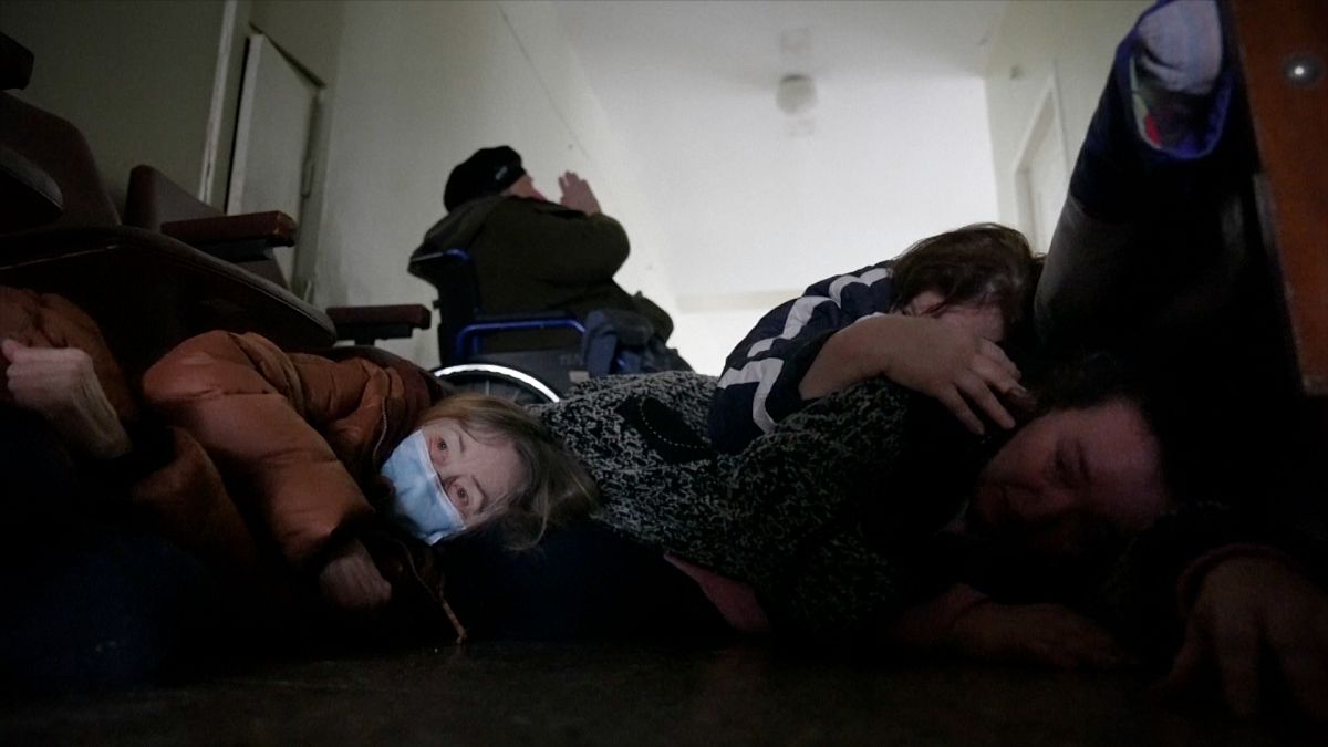 Women sheltering from shelling on floor of hospital corridor in Mariupol.