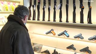 A shopper in a gun shop 