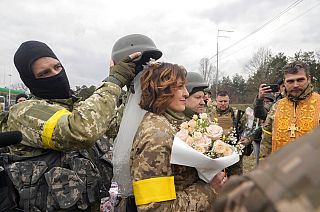 Ukrainian soldiers tie the knot at checkpoint on the outskirts of Kyiv