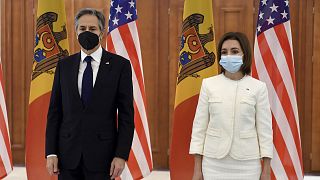 US Secretary of State Antony Blinken, left, poses with Moldovan President Maia Sandu