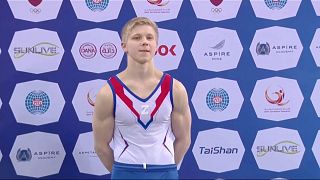 Russia gymnast, Ivan Kuliak, wear 'Z' on chest when picking up bronze medal at Gymnastics World Cup.