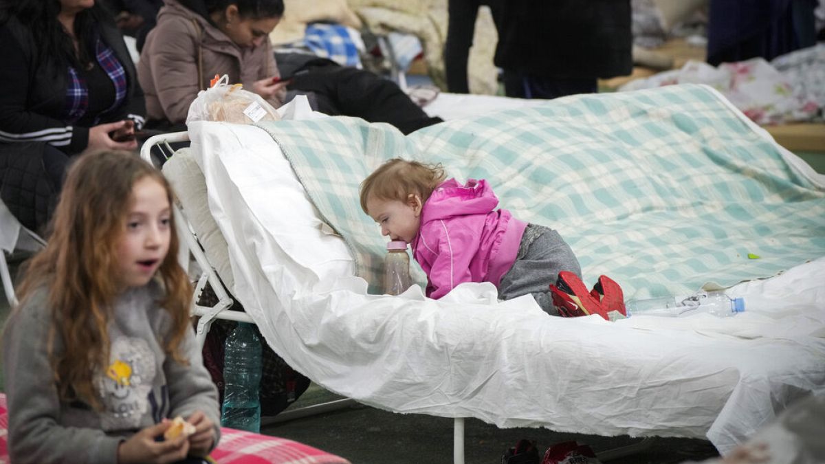 Refugees from Ukraine rest inside a facility for refugees in Chisinau, Moldova, Saturday, March 5, 2022. 