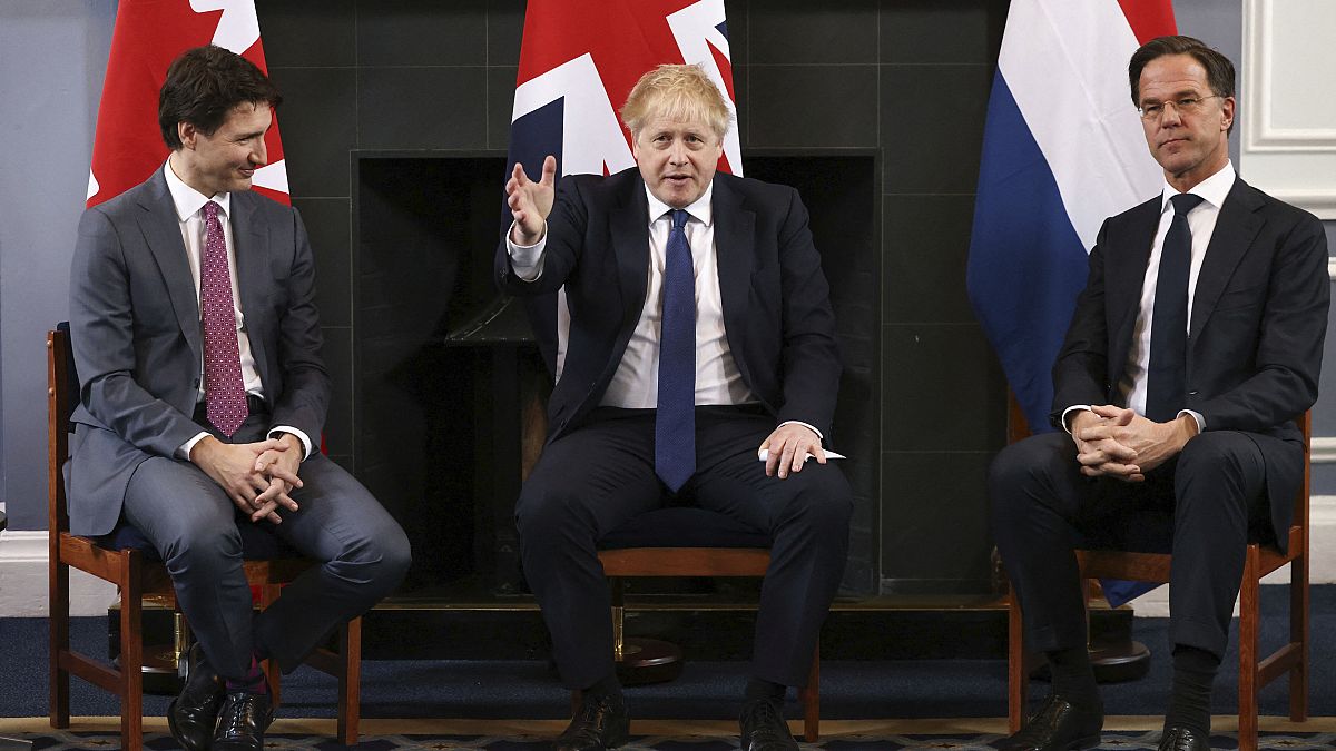 Canadian Prime Minister Justin Trudeau, British Prime Minister Boris Johnson and Dutch Prime Minister Mark Rutte sit during a meeting in London.