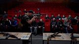 Pavlo Ganovskyi teaches civilians how to use AK47 rifles.