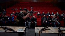 civilians attend weapons training in Lviv's former Film Centre