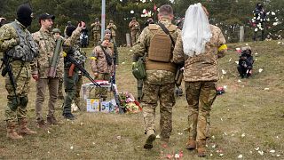 Two Ukrainian soldiers marry on the frontline of the Russian invasion