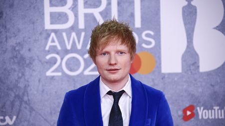 Ed Sheeran poses for photographers upon arrival at the Brit Awards 2022 in London Tuesday, Feb. 8, 2022.