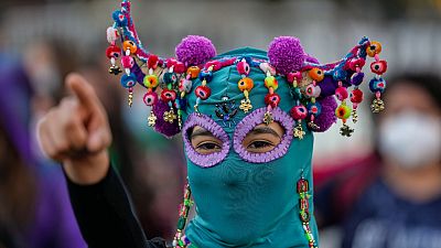 A costumed demonstrators performs the song "Un violador en tu camino" or A rapist in your path during a demonstration against gender-based violence in Santiago, Chile, 07.03.