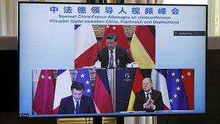 El presidente francés Emmanuel Macron, el canciller alemán Olaf Scholz y el presidente chino Xi Jinping, durante una videoconferencia el martes 8 de marzo de 2022