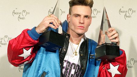Vanilla Ice displays his awards he won in the rock and rap catagories at the American Music Awards in Los Angeles, Calif., on Jan. 28, 1991