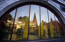 Moscow McDonald's outlet, with a reflection of St. Basil's Cathedral in its windows in 2014.