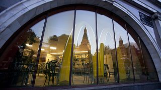 Moscow McDonald's outlet, with a reflection of St. Basil's Cathedral in its windows in 2014.