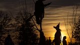 A visitor in a witch's hat during Halloween in Leipzig, eastern Germany.