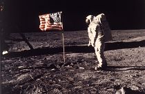 Astronaut Edwin E. "Buzz" Aldrin Jr. poses for a photograph beside the U.S. flag deployed on the moon during the Apollo 11 mission on July 20, 1969