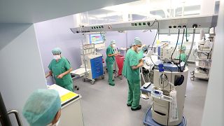 Doctors and nurses in the operating room in the hospital in Prenzlau, Germany.