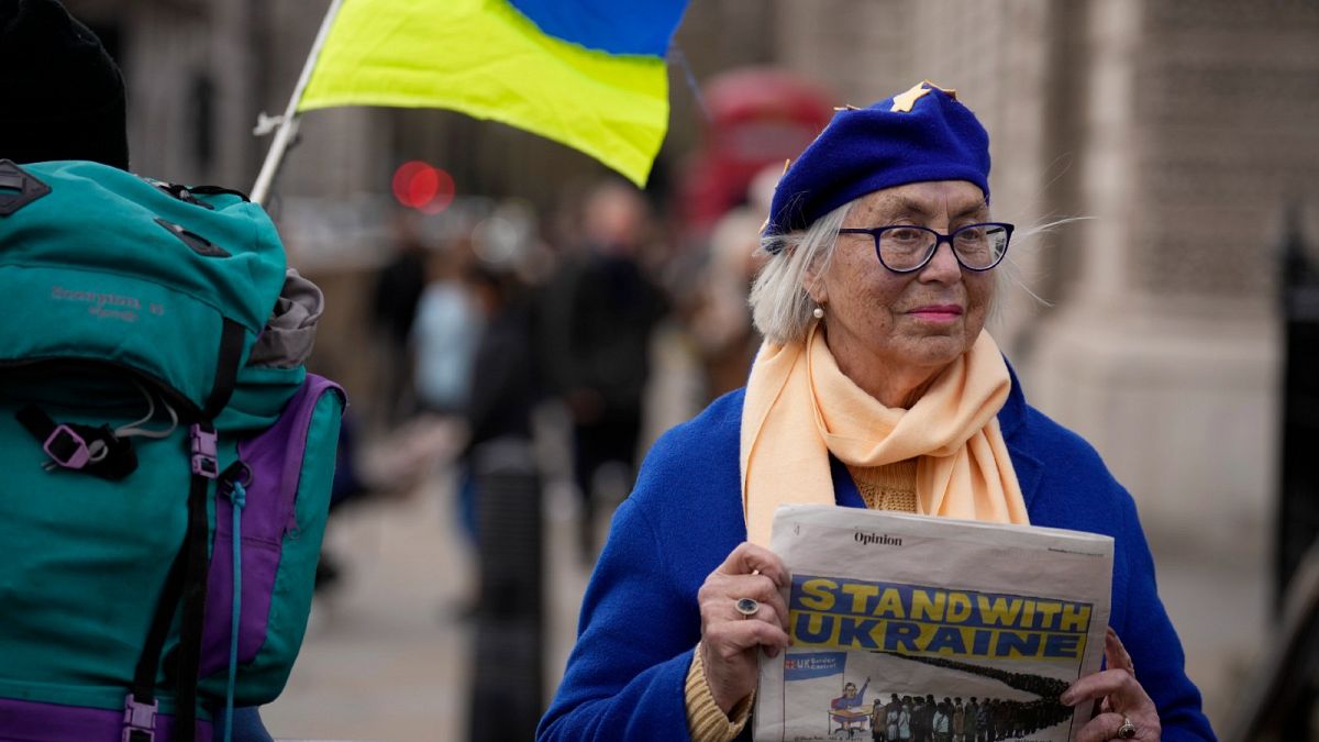 A demonstrator protests against the British government's response to the Russian invasion of Ukraine  in London, Wednesday, March 9, 2022.