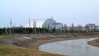 A picture taken on April 13, 2021 shows the giant protective dome built over the sarcophagus covering the destroyed fourth reactor of the Chernobyl Nuclear Power Plant.
