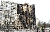 This picture shows an apartment building damaged after shelling the day before in Ukraine's second-biggest city of Kharkiv on March 8, 2022.
