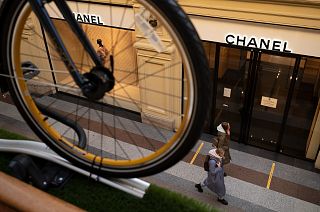 Visitors walk past a closed Chanel boutique inside the GUM department store in Moscow, Russia, Wednesday, March 9, 2022